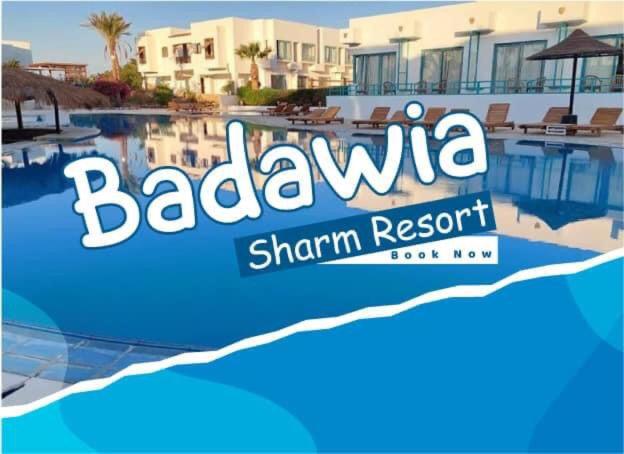 シャルム・エル・シェイクにあるBadawia Sharm Resortのビーチリゾートのスイミングプールの看板