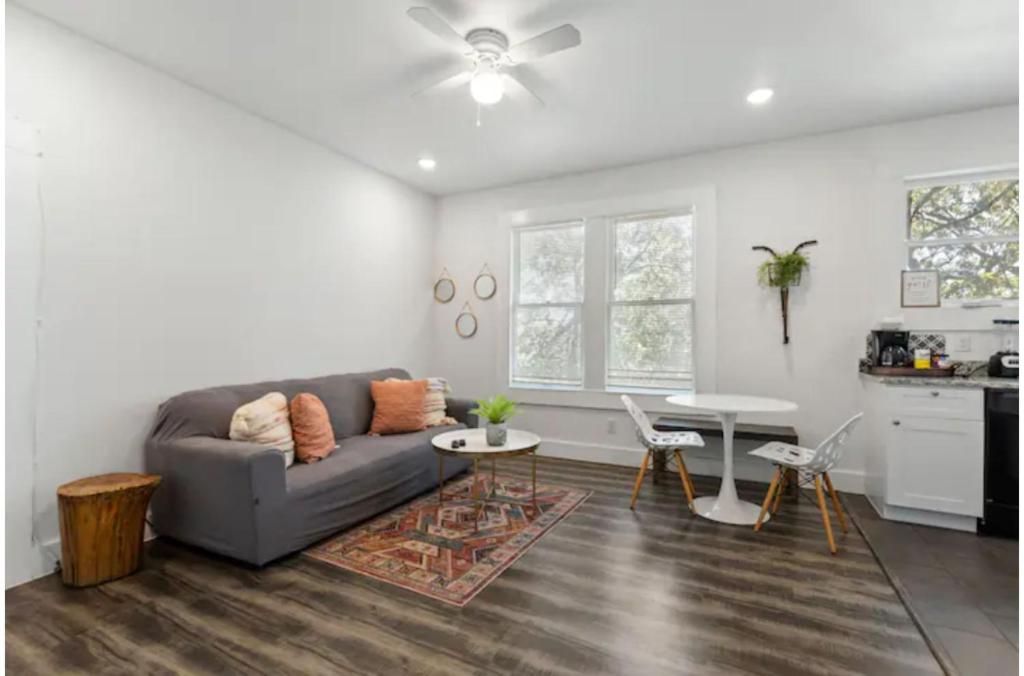 a living room with a couch and a table at Impressive Cozy Historic 2BR Apt Near Downtown in San Antonio