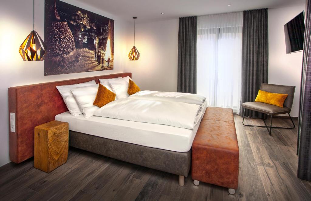 Postel nebo postele na pokoji v ubytování Rose Bistro & Gästezimmer