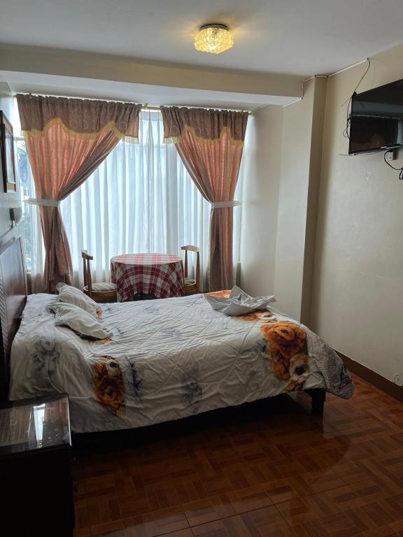 Postel nebo postele na pokoji v ubytování Hotel Cotopaxi