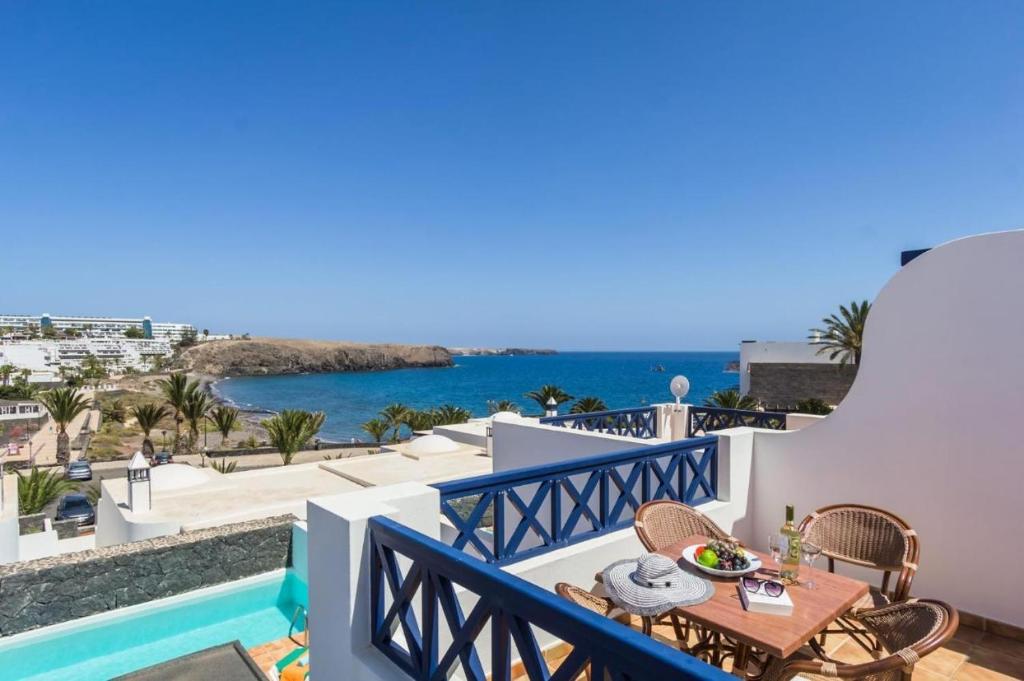 a view of the ocean from the balcony of a villa at Coloradas Villa Alba in Playa Blanca