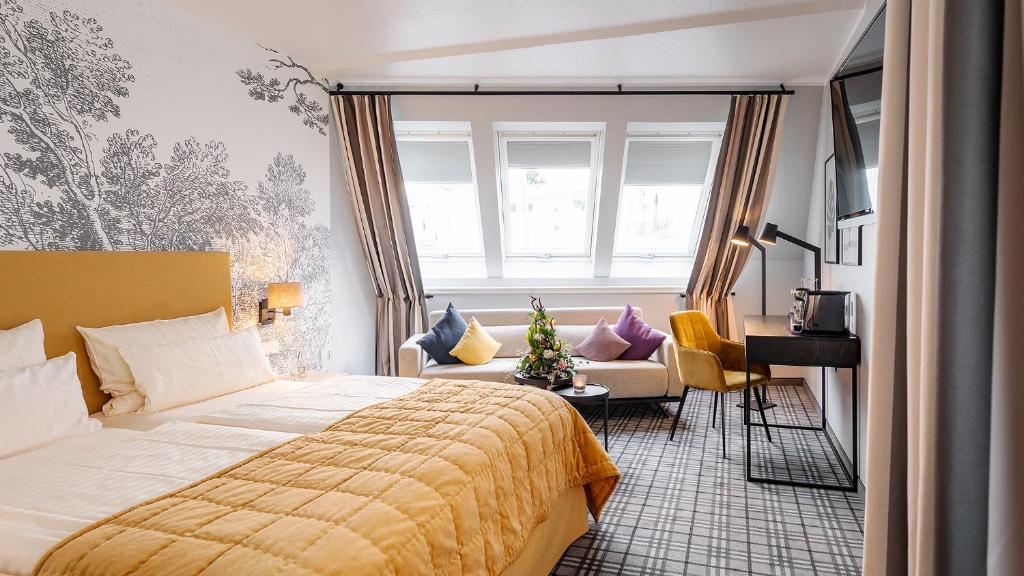 Postel nebo postele na pokoji v ubytování Hotel Ambiente