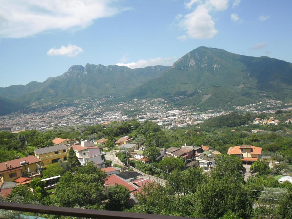 a view of a city with mountains in the background at Agriturismo La Selva in Cava deʼ Tirreni