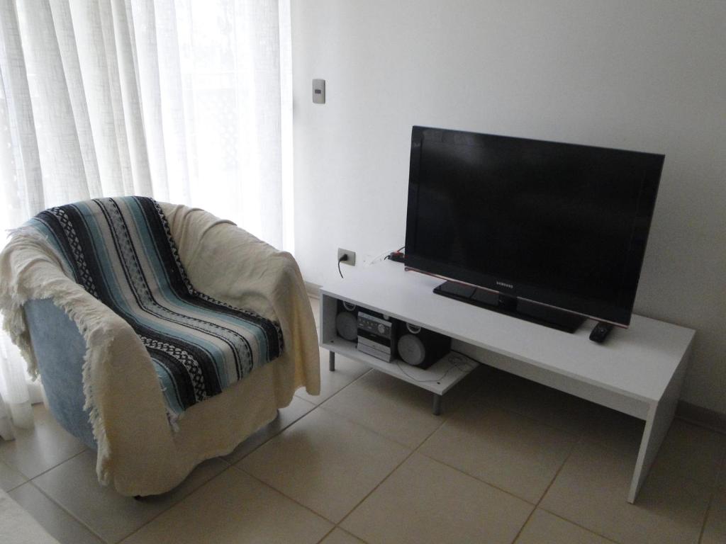 TV a/nebo společenská místnost v ubytování COSTA ALGARROBO