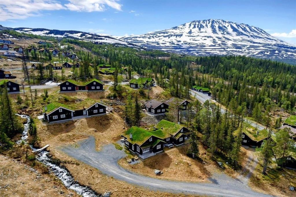an aerial view of a resort with a snow covered mountain at Gaustablikk hytta ski-in ski-out in Gaustablikk