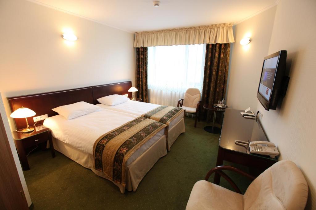 TV a/nebo společenská místnost v ubytování Hotel Janusz