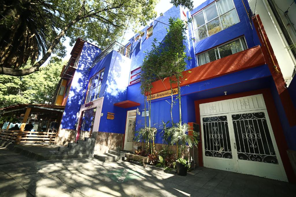 a blue and white building with a sign on it at Casa Anzures in Mexico City
