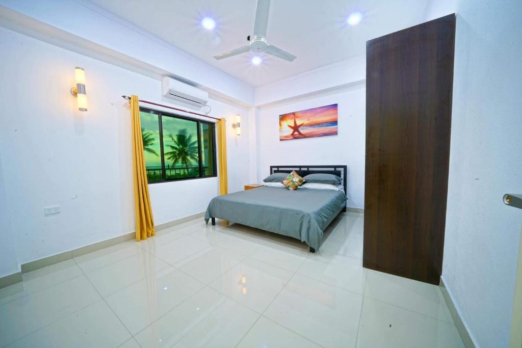 Postel nebo postele na pokoji v ubytování Coastal Suites Fiji