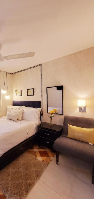 Postel nebo postele na pokoji v ubytování Hotel Santa Clara