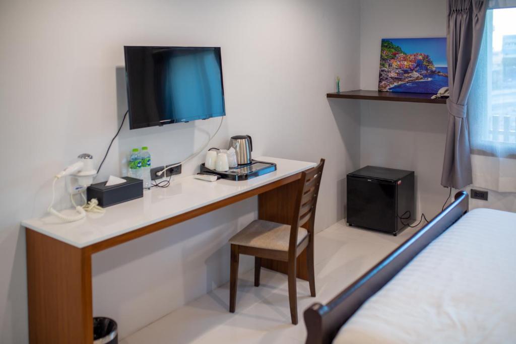 TV a/nebo společenská místnost v ubytování WE Terminal Hotel