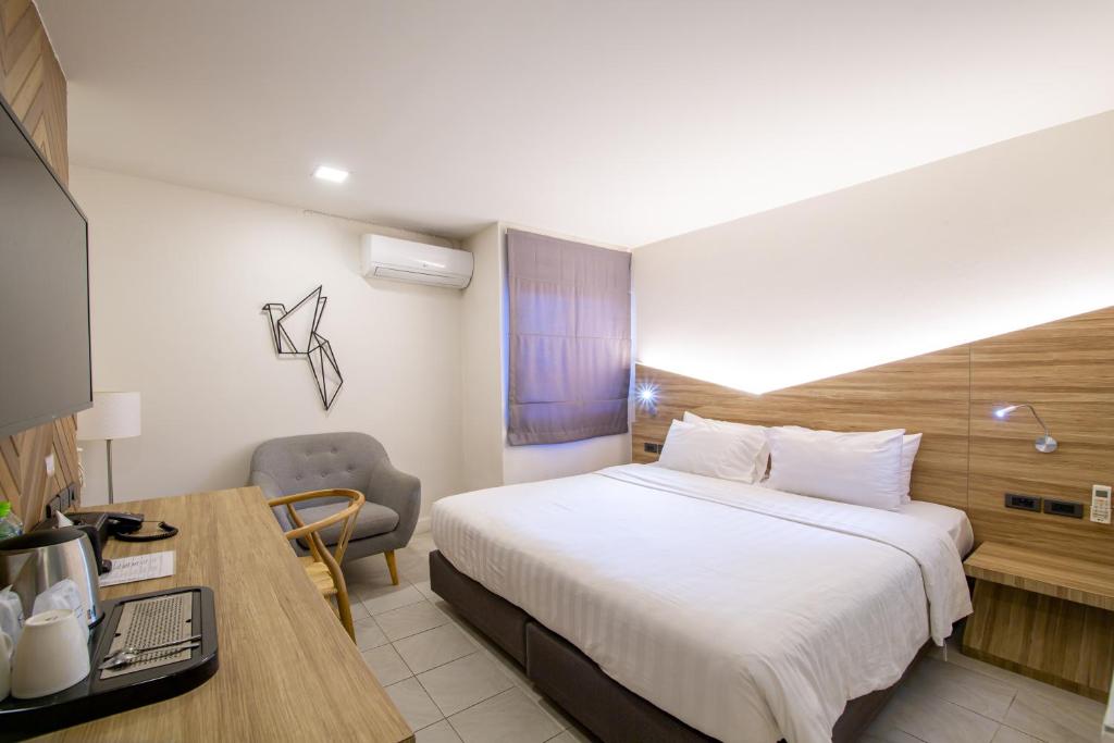 Postel nebo postele na pokoji v ubytování WE Terminal Hotel