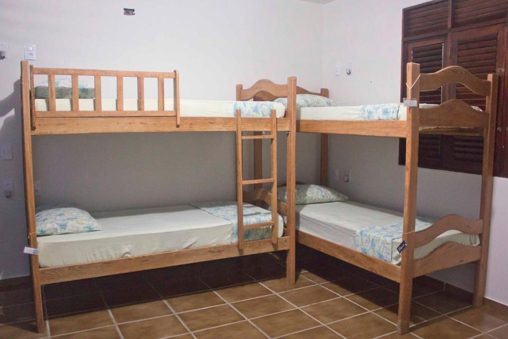 Postel nebo postele na pokoji v ubytování Slow Hostel - Hospedagem Criativa
