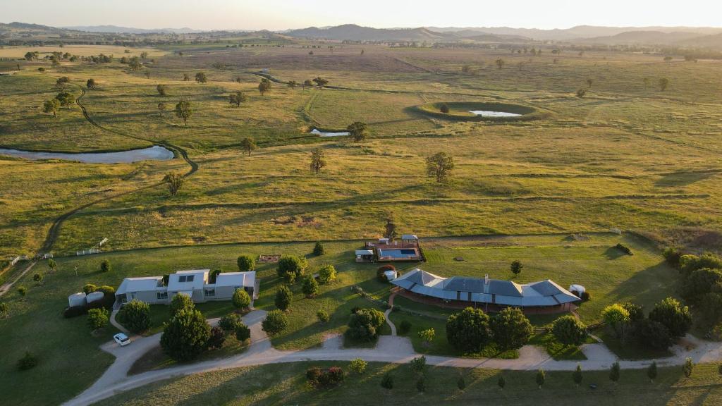 an aerial view of a house in a field at Owl Head Lodge in Gulgong
