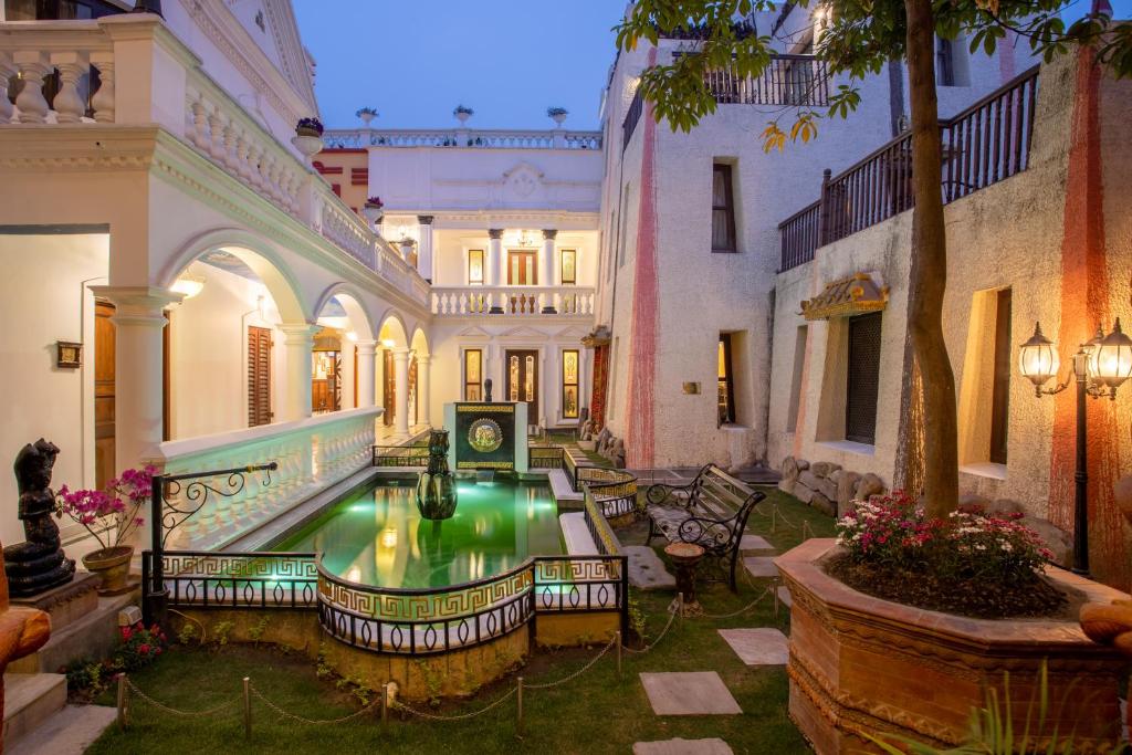 a courtyard with a fountain in the middle of a building at Baber Mahal Vilas - The Heritage Hotel in Kathmandu