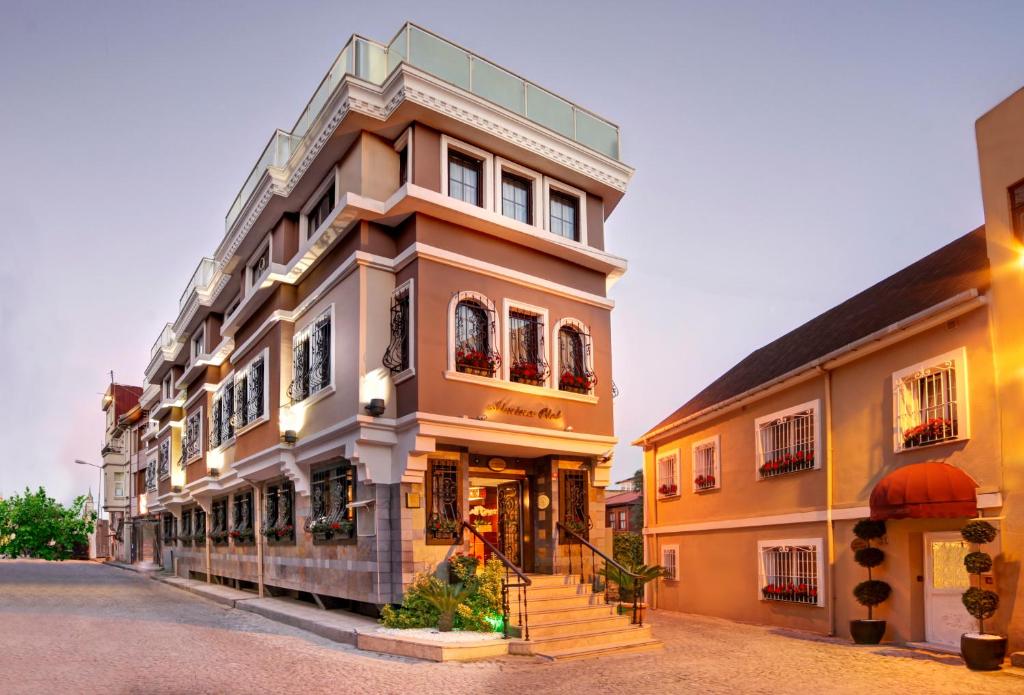 a building on a street next to other buildings at Almina Hotel - Special Class in Istanbul