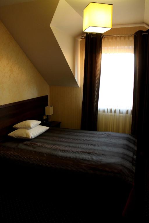 Posteľ alebo postele v izbe v ubytovaní Hotel Linder