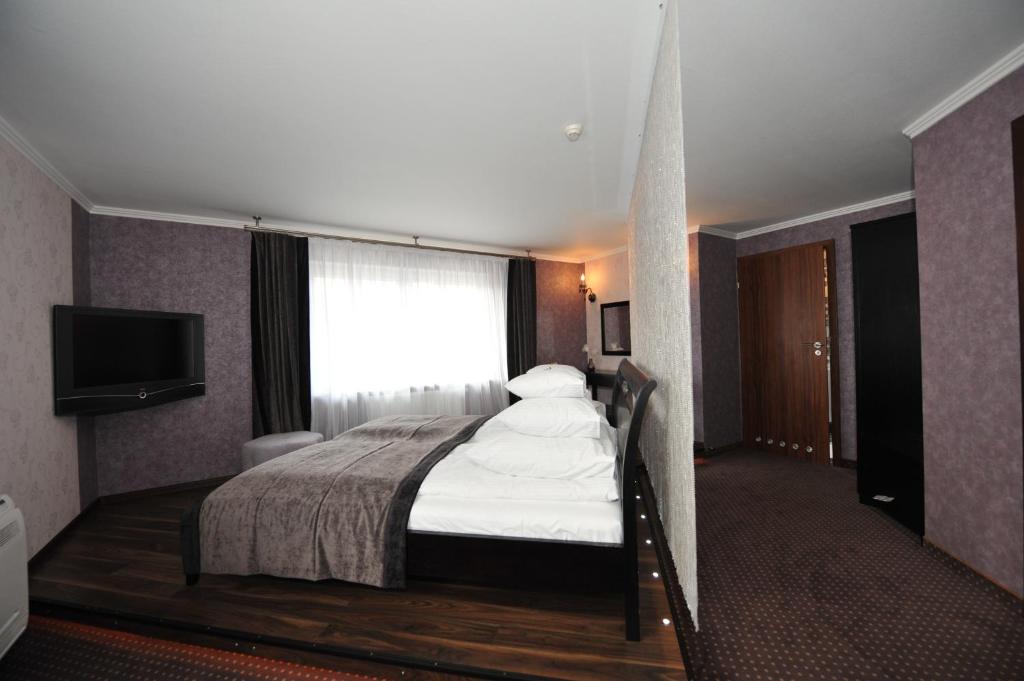 Posteľ alebo postele v izbe v ubytovaní Hotel Linder