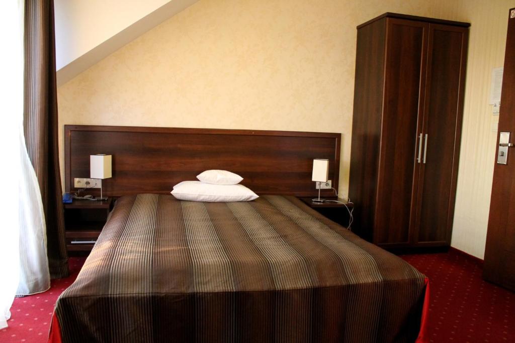 Posteľ alebo postele v izbe v ubytovaní Hotel Linder