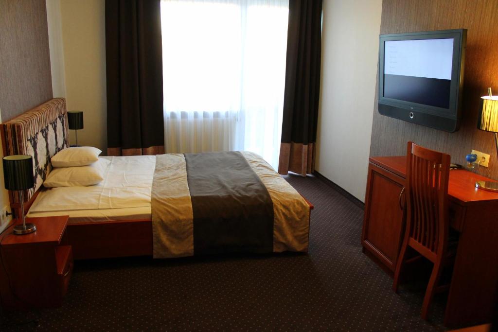 Posteľ alebo postele v izbe v ubytovaní Hotel Linder