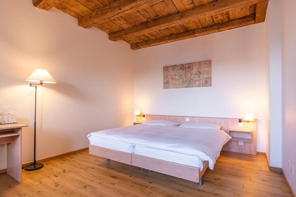 Postel nebo postele na pokoji v ubytování Le Rive Sud