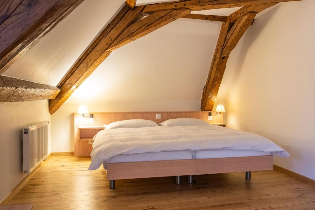 Postel nebo postele na pokoji v ubytování Le Rive Sud