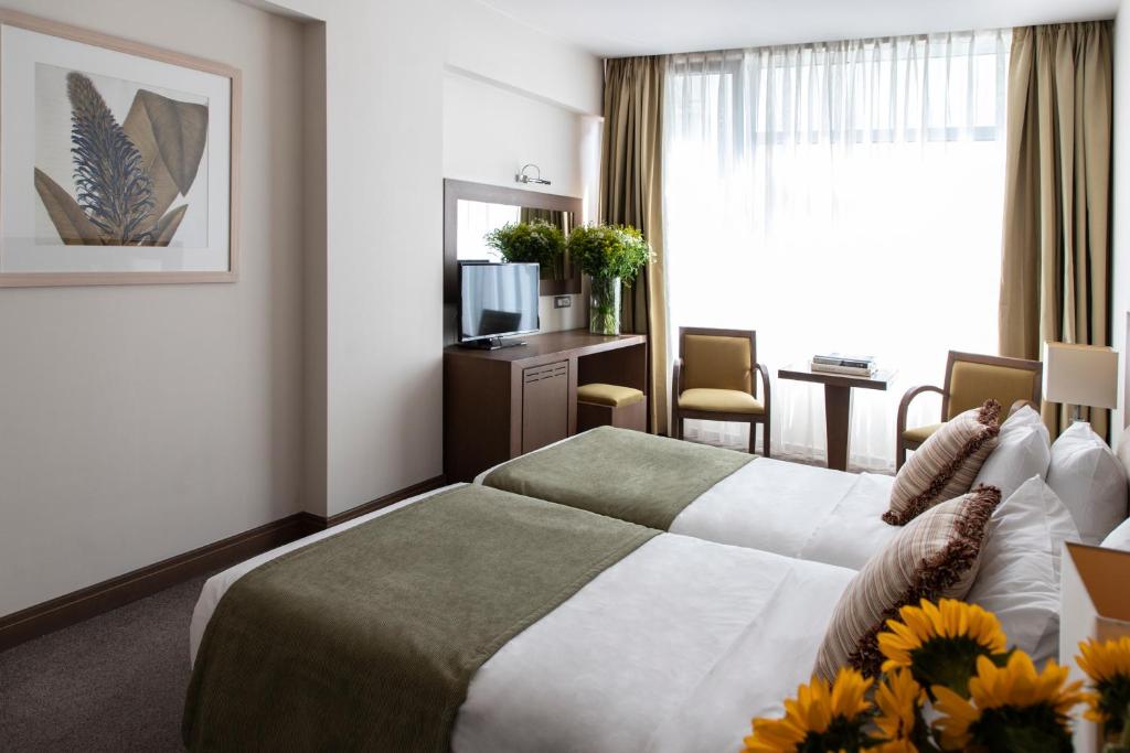 Postel nebo postele na pokoji v ubytování Amalia Hotel Athens