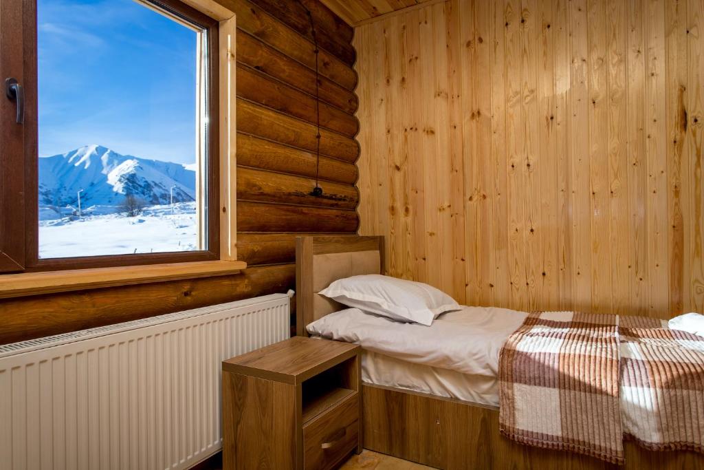 Postel nebo postele na pokoji v ubytování Snow Time Eco Chalet