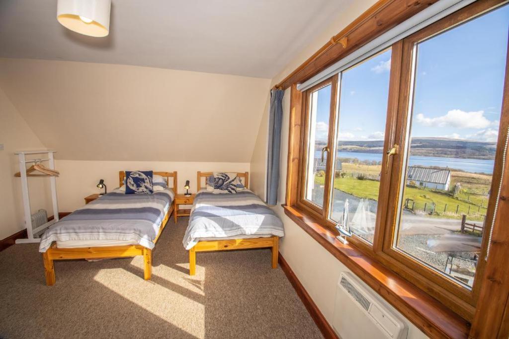 Postel nebo postele na pokoji v ubytování Arle Lodge