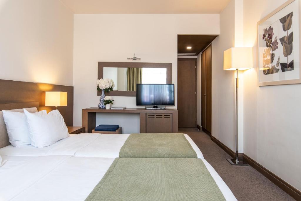 Postel nebo postele na pokoji v ubytování Amalia Hotel Athens
