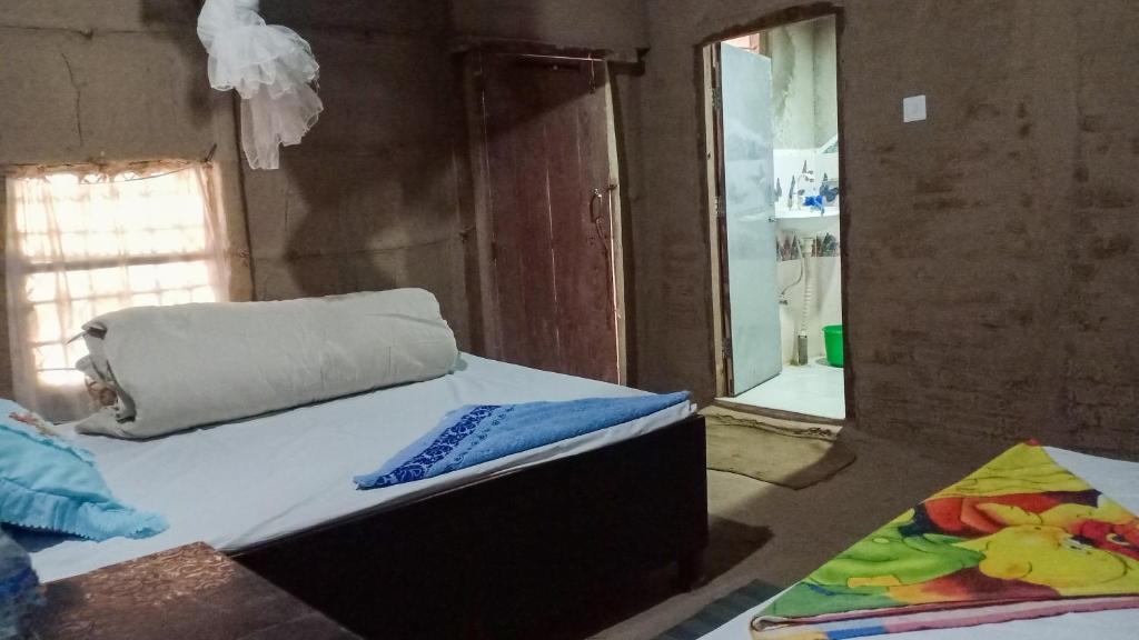 Postel nebo postele na pokoji v ubytování Bardiya Community Homestay