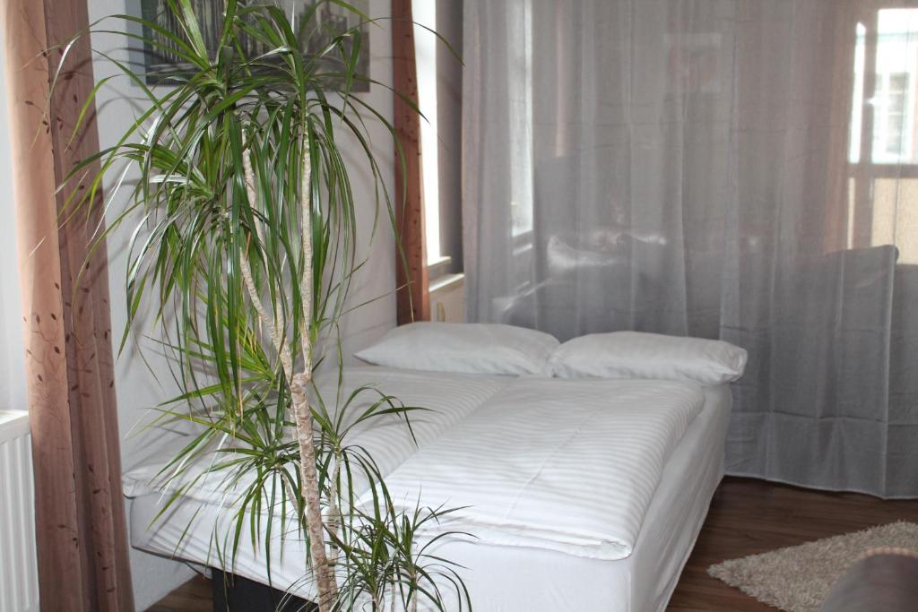 Postel nebo postele na pokoji v ubytování Murphy's Zimmer und Apartments