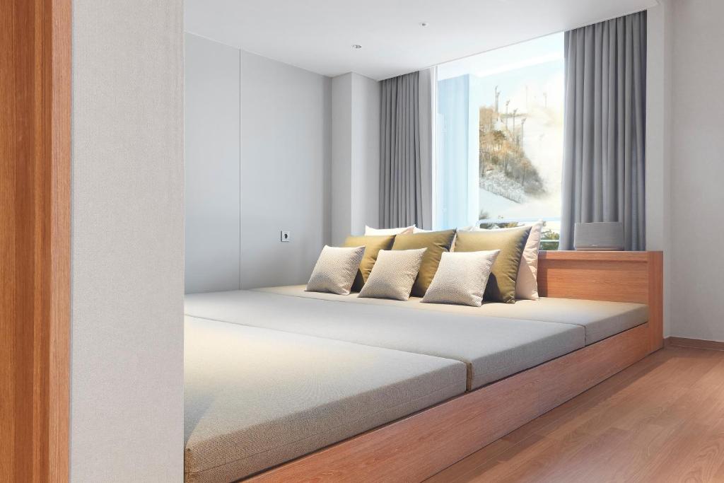 Postel nebo postele na pokoji v ubytování Phoenix Resort Pyeongchang