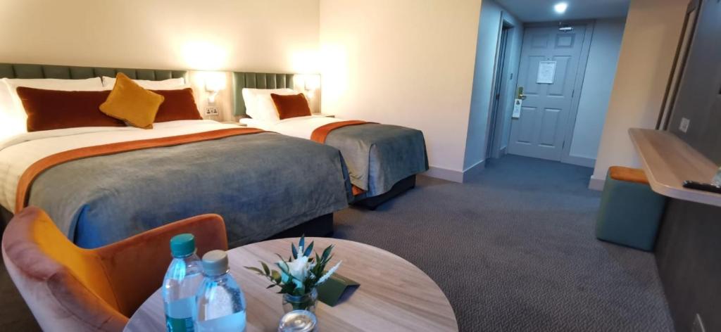 Postelja oz. postelje v sobi nastanitve Greenhills Hotel Limerick