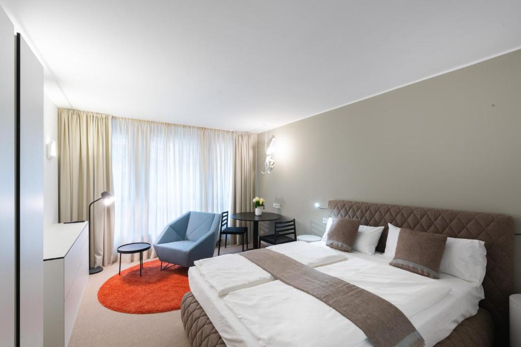 Postel nebo postele na pokoji v ubytování Studiohouse Frankfurt