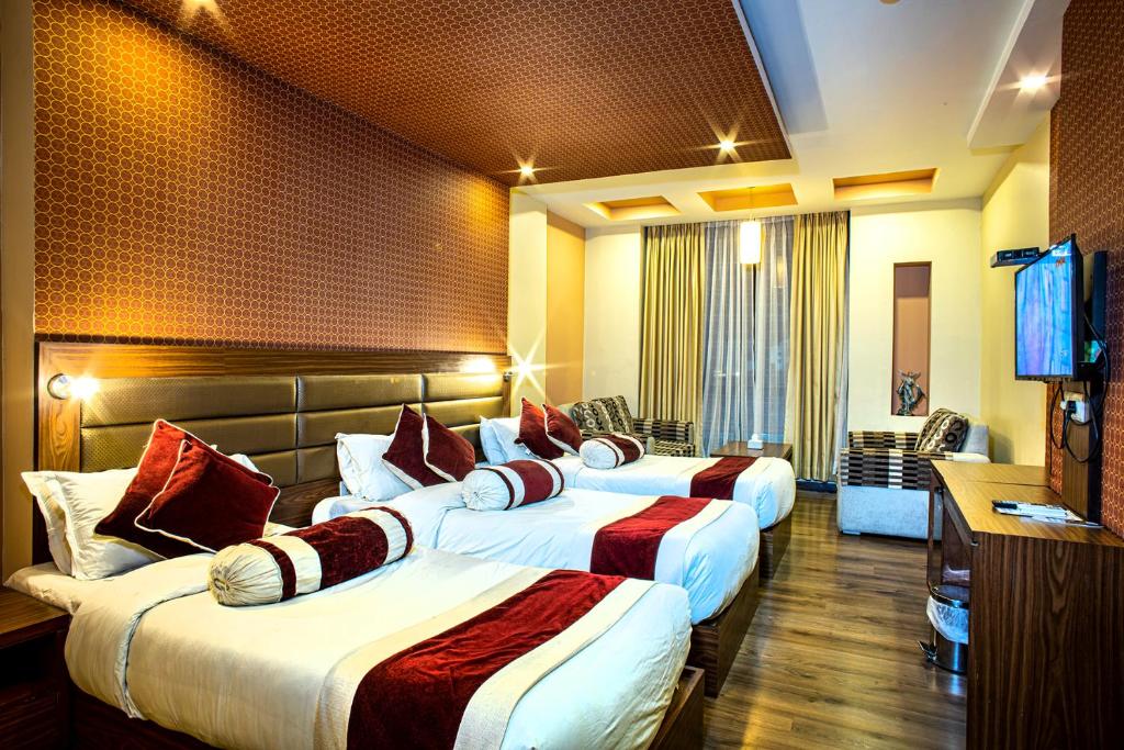 Letto o letti in una camera di The Address Kathmandu Hotel