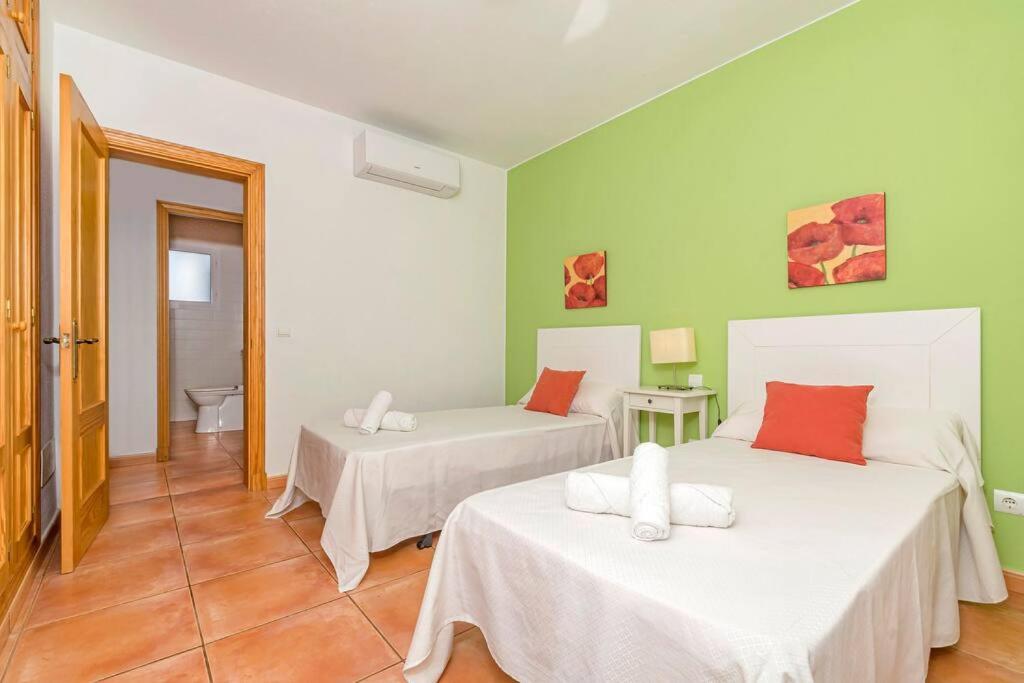 Postel nebo postele na pokoji v ubytování Villa Casa Nova