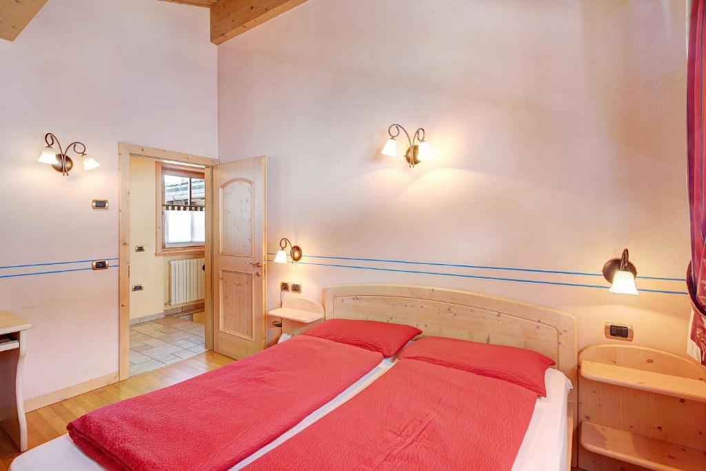 Posteľ alebo postele v izbe v ubytovaní Chalet Betty Appartamento Larasc