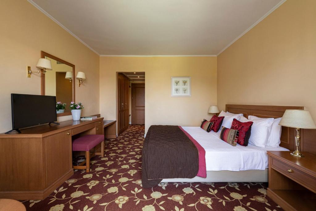 Postel nebo postele na pokoji v ubytování Amalia Hotel Nafplio
