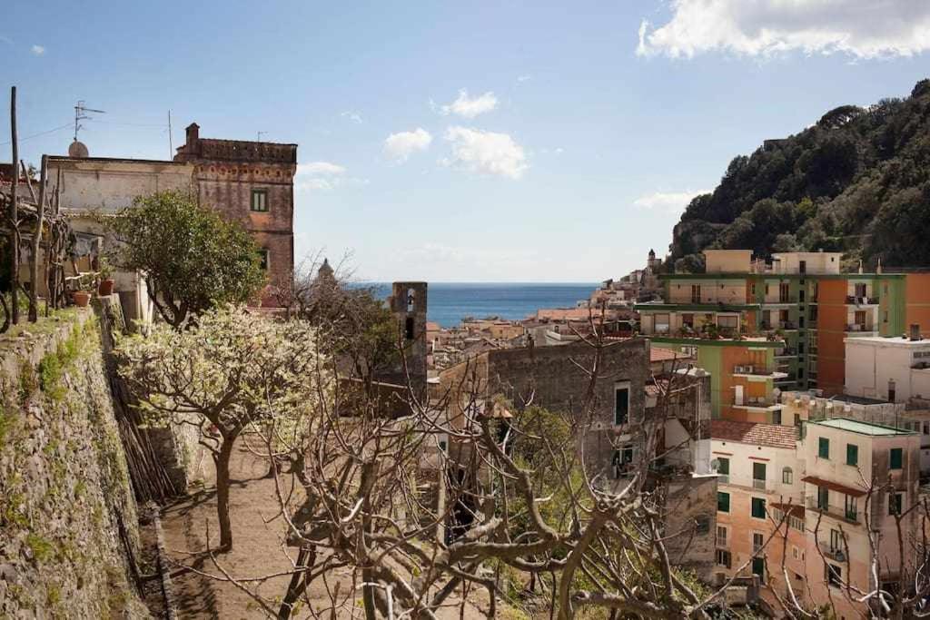 a view of a city with buildings and the ocean at Donna Saretta Casetta tradizionale Amalfitana in Amalfi
