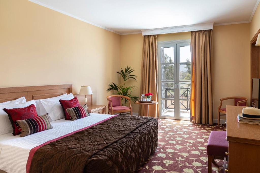 Postel nebo postele na pokoji v ubytování Amalia Hotel Nafplio