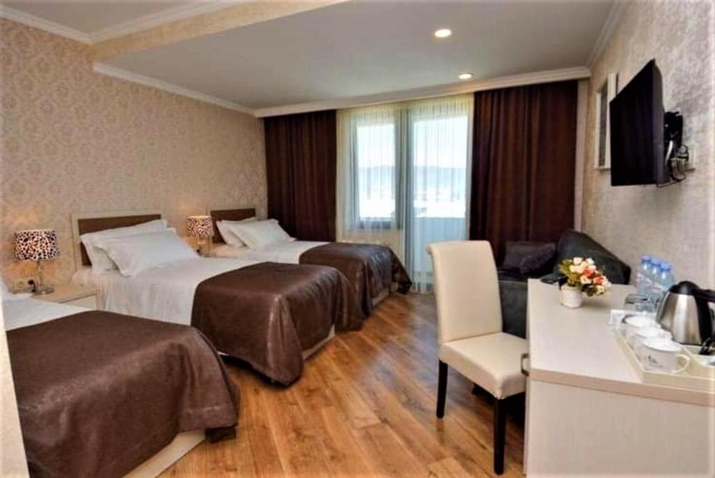Letto o letti in una camera di Hotel King David Bakuriani
