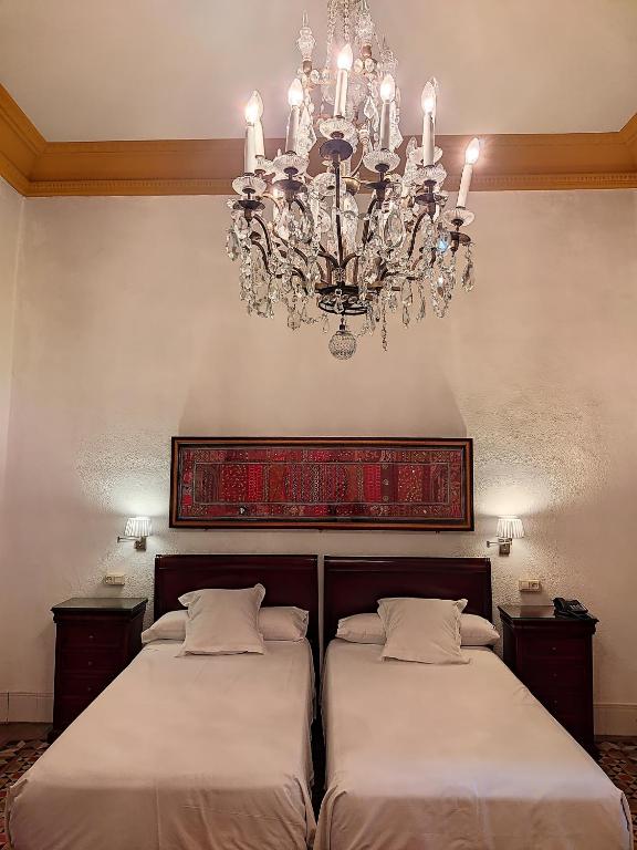 Posteľ alebo postele v izbe v ubytovaní Hotel Simon