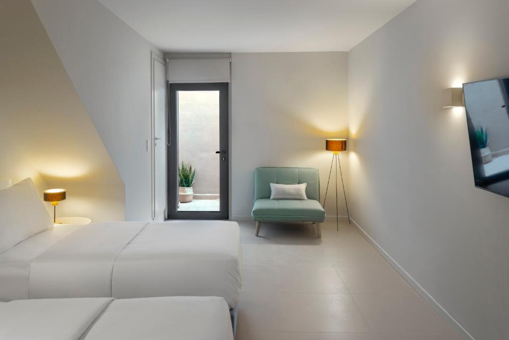 Postel nebo postele na pokoji v ubytování Greenstone Villas
