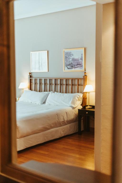 Postel nebo postele na pokoji v ubytování Barceló León Conde Luna