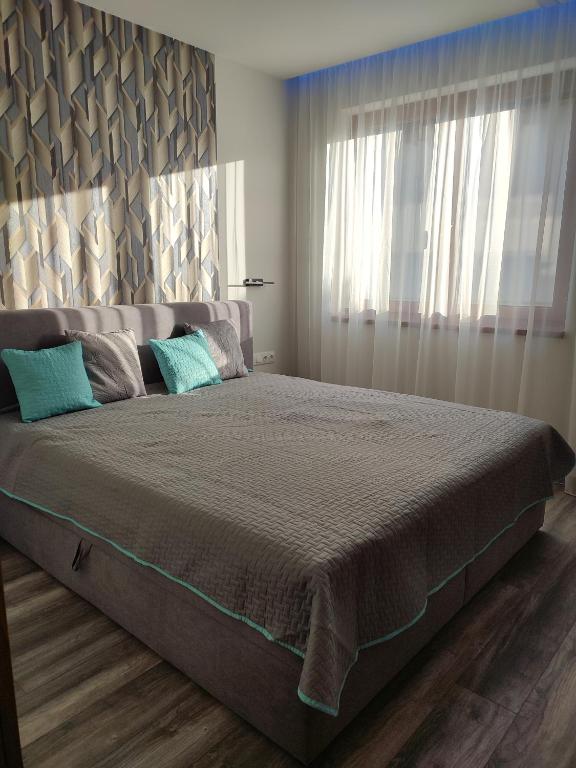 Postel nebo postele na pokoji v ubytování Gamma Apartmanok és Jakuzzi