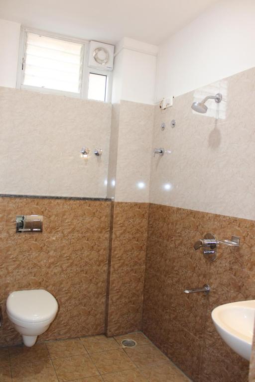 Koupelna v ubytování Sai Vihaar Inn & Suites