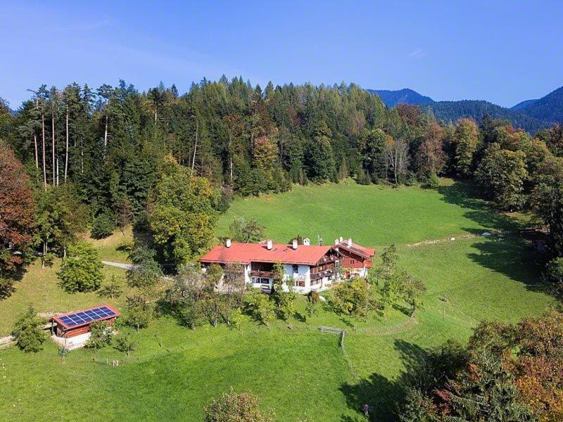 an aerial view of a large house in a field at Ferienwohnung Leitenlehen in Berchtesgaden