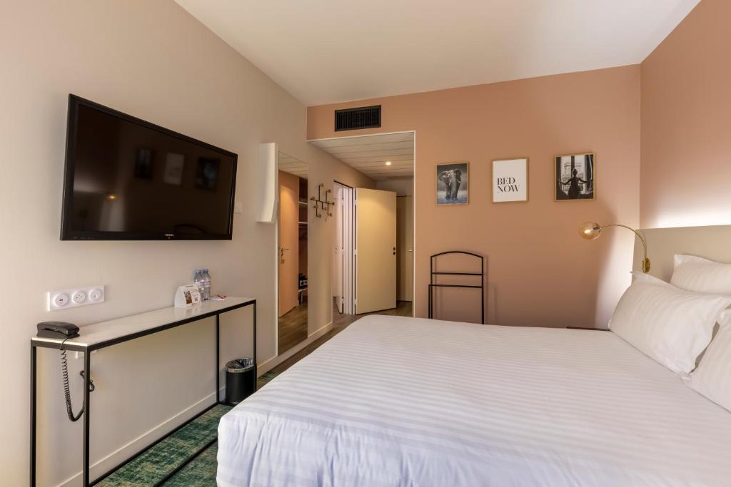 Postel nebo postele na pokoji v ubytování PADJA Hôtel & Spa Vannes