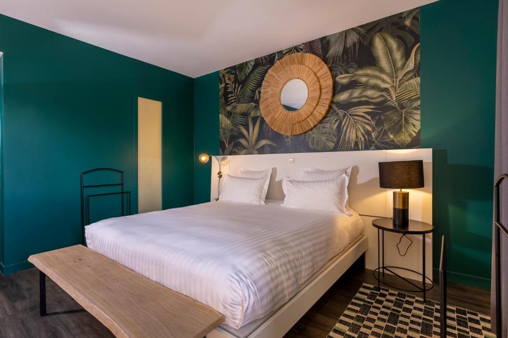 Postel nebo postele na pokoji v ubytování PADJA Hôtel & Spa Vannes