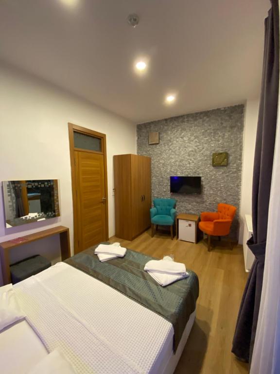 TV a/nebo společenská místnost v ubytování Masal Hotel